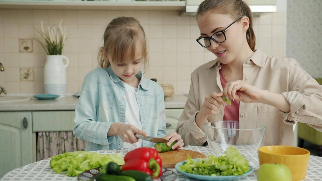 Children eating healthy vegetables and fruits